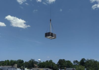 Crane transporting commercial HVAC unit for George Regional Hospital