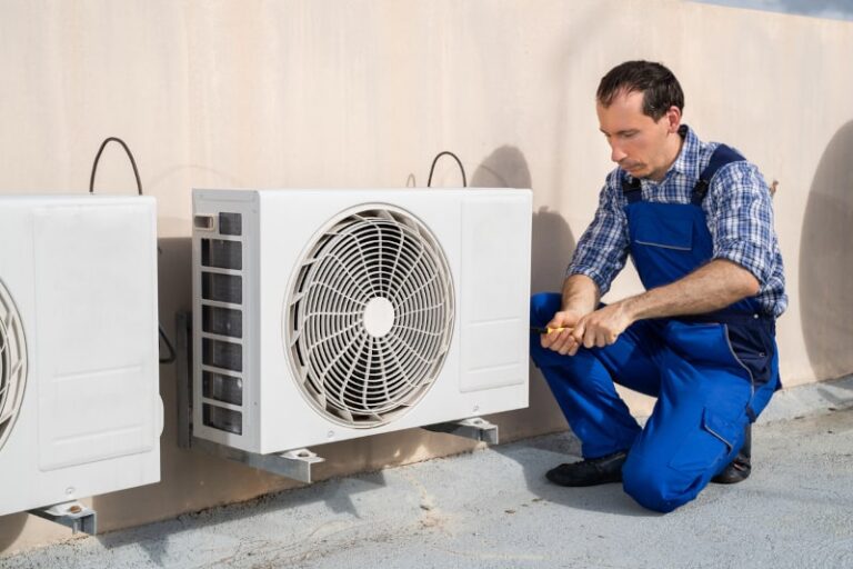 technician installing HVAC system